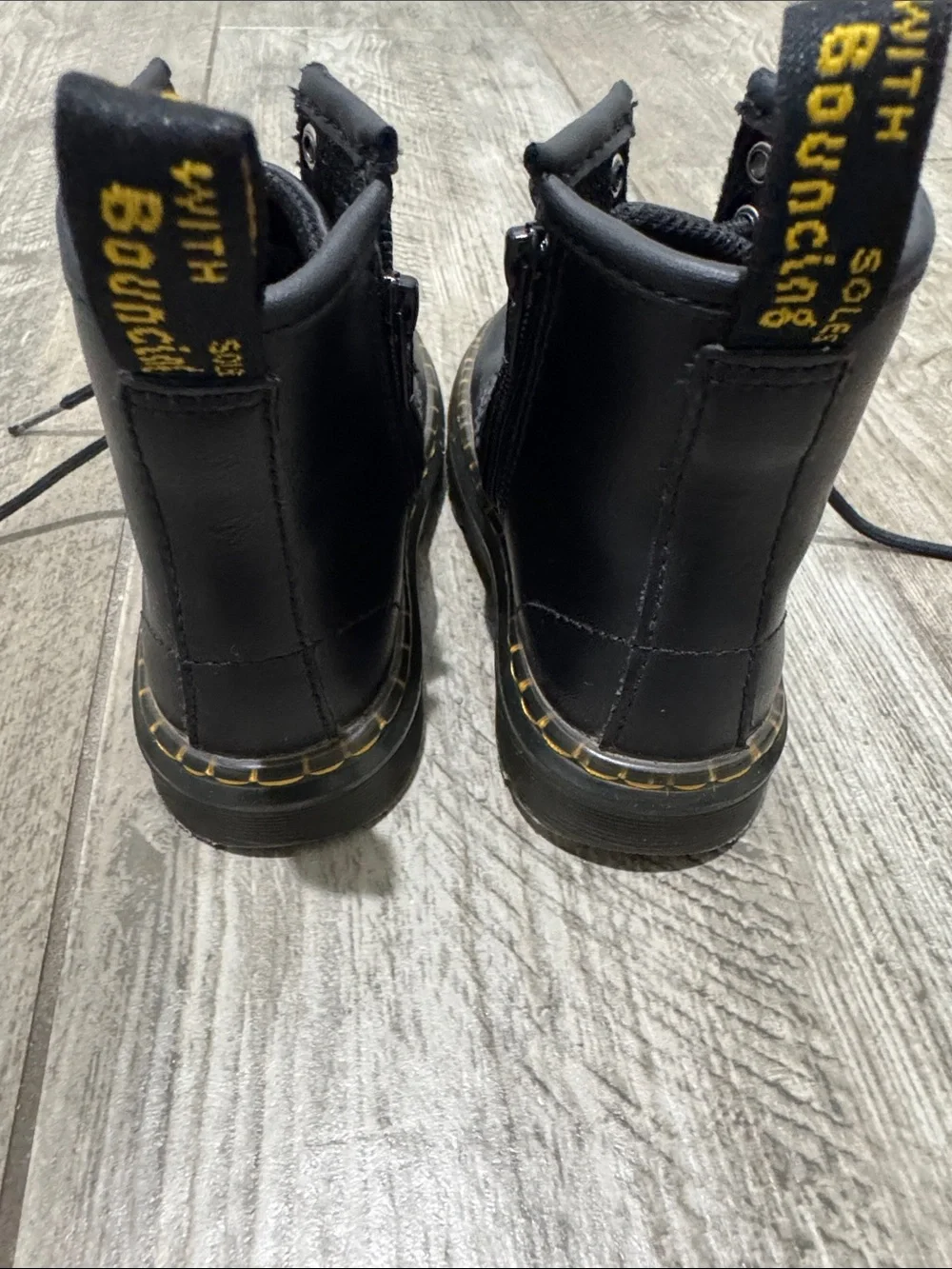Dr. Martens Kids Black Lace-Up Boots with Yellow Stitching